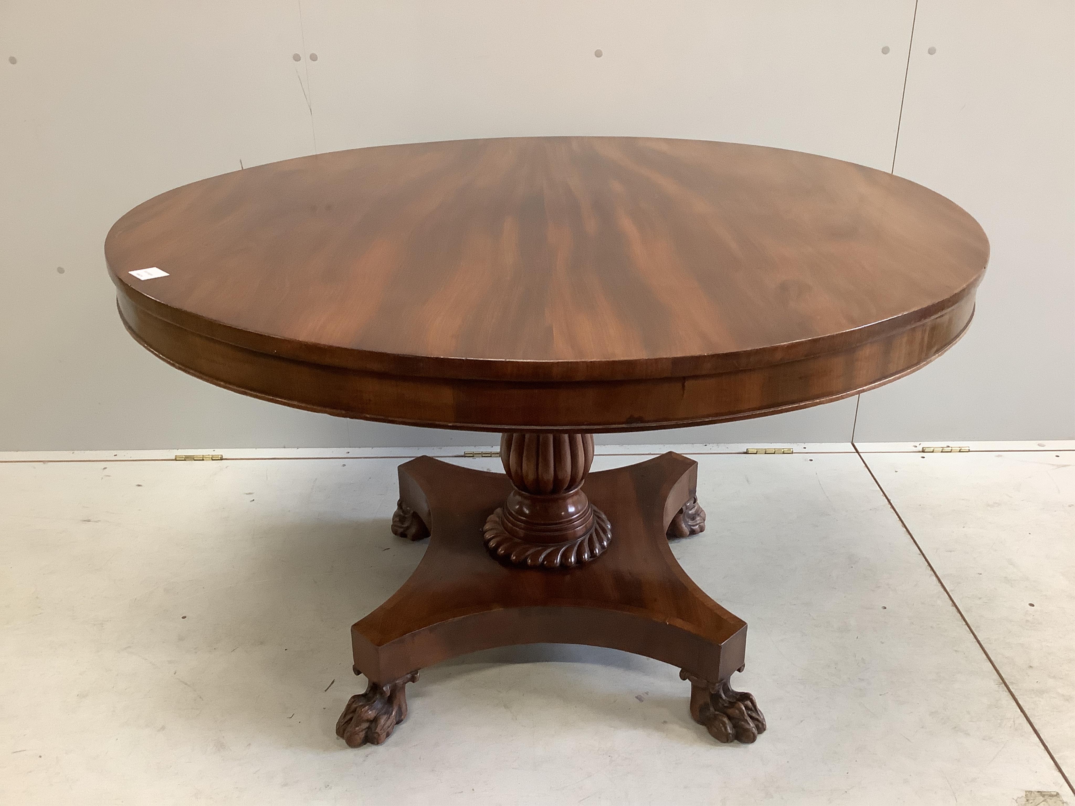 An early Victorian mahogany circular tilt top breakfast table, on a pillar and flat quadruple platform base, diameter 120cm, height 74cm. Condition - good